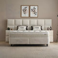 CONSO Boxspringbett in Beige mit Stoffbezug, Frontansicht mit gepolstertem Kopfteil, Matratze und Topper im Schlafzimmer