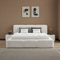 Esila Boxspringbett in Creme mit Stoffbezug, Frontansicht mit gepolstertem Kopfteil, Matratze und Topper