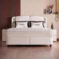 Phoenix Boxspringbett in Bouclé Beige, Frontansicht mit gepolstertem Kopfteil, Matratze und Topper im modernen Schlafzimmer