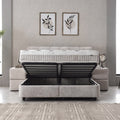 Lucia Boxspringbett Grau-Beige mit geöffnetem Bettkasten, freiliegender Rahmen zeigt Stauraum unter Matratze und Topper