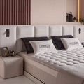 Lennon Boxspringbett Detail: gestepptes Kopfteil in Bouclé Beige mit Topper-Matratze und Lennon-Kissen