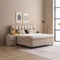 Wind Boxspringbett in Beige, seitliche Ansicht mit Stoffbezug, Kopfteil und Nachttisch im hellen Schlafzimmer