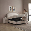 Fancy Boxspringbett Beige mit geöffnetem Bettkasten, Frau hebt Matratze an, viel Stauraum unter der Liegefläche in Samt Velours