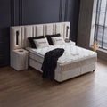 Riviera Boxspringbett Webstoff Beige in Seitenansicht mit Kopfteil, Nachttisch und komfortabler Matratze mit Topper
